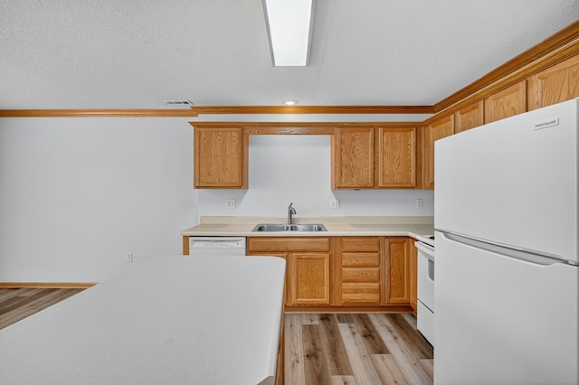 8302 Westown Pkwy Unit 7106, West Des Moines, IA 50266 - kitchen with white appliances, light countertops, light wood finished floors, and recessed lighting