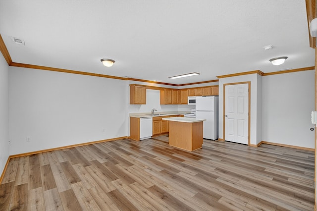 8302 Westown Pkwy Unit 7106, West Des Moines, IA 50266 - kitchen with light countertops, ornamental molding, light wood-style flooring, white appliances, and a kitchen island