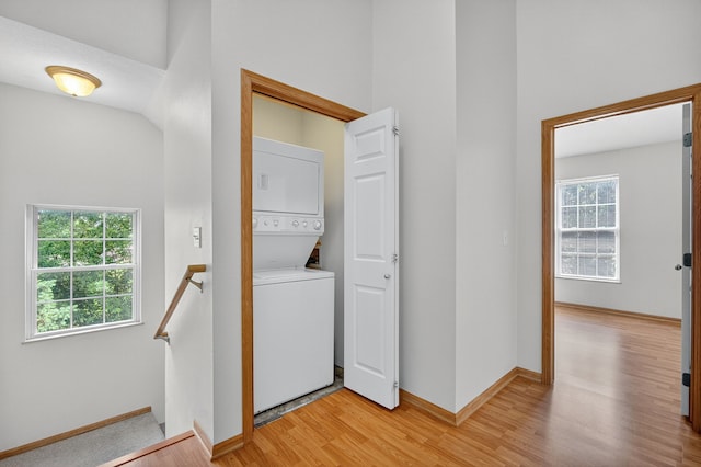 8302 Westown Pkwy Unit 7106, West Des Moines, IA 50266 - laundry room with stacked washer / drying machine and light wood finished floors
