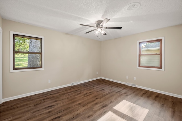 3312 Kinsey Ave, Des Moines, IA 50317 - spare room with a textured ceiling, wood finished floors, and a ceiling fan