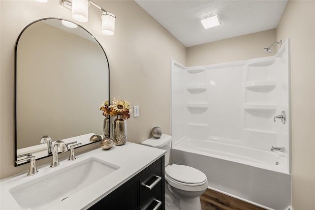 3312 Kinsey Ave, Des Moines, IA 50317 - bathroom featuring vanity, wood finished floors, and shower / washtub combination
