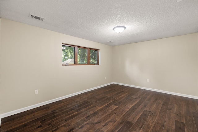3312 Kinsey Ave, Des Moines, IA 50317 - empty room with dark wood-style flooring and a textured ceiling