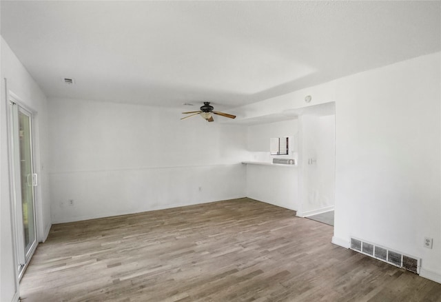 1356 E 17th Ct, Des Moines, IA 50316 - spare room with a ceiling fan and wood finished floors