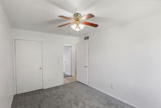 1356 E 17th Ct, Des Moines, IA 50316 - unfurnished bedroom with carpet flooring and a ceiling fan