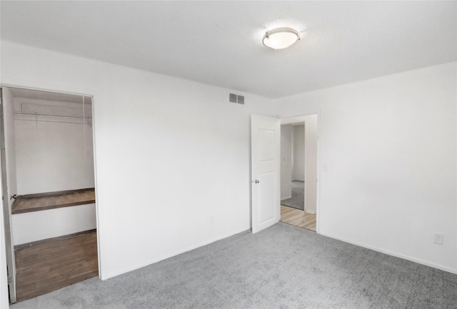1356 E 17th Ct, Des Moines, IA 50316 - unfurnished bedroom with carpet and a closet