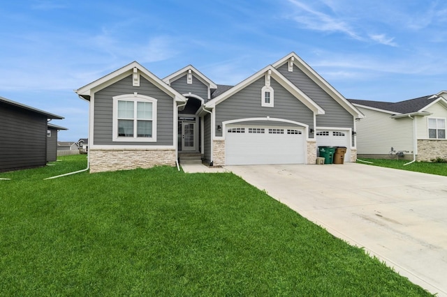 220 11th Ct NW, Bondurant, IA 50035 - craftsman house with stone siding, a front lawn, driveway, and a garage