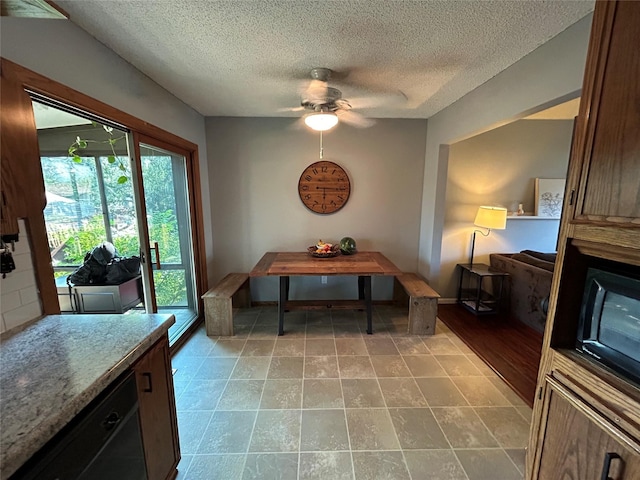 1016 1st St NW, Altoona, IA 50009 - dining space featuring a textured ceiling and a ceiling fan