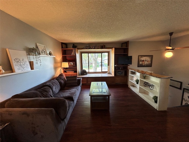 1016 1st St NW, Altoona, IA 50009 - living area with a textured ceiling, dark wood-type flooring, and ceiling fan