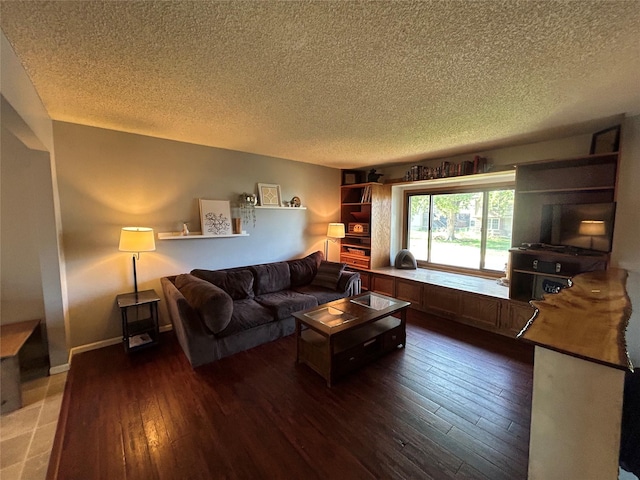 1016 1st St NW, Altoona, IA 50009 - living area featuring a textured ceiling and dark wood finished floors