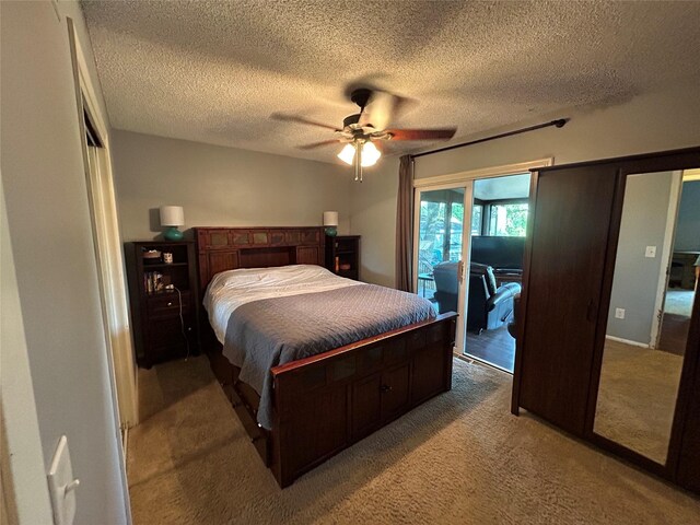 1016 1st St NW, Altoona, IA 50009 - carpeted bedroom featuring access to exterior, a textured ceiling, and a ceiling fan