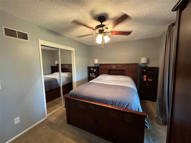 1016 1st St NW, Altoona, IA 50009 - carpeted bedroom featuring a closet, a ceiling fan, and a textured ceiling