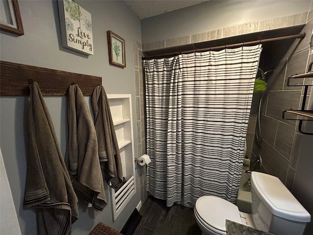 1016 1st St NW, Altoona, IA 50009 - full bathroom with shower / bath combo and wood finished floors
