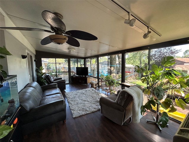 1016 1st St NW, Altoona, IA 50009 - sunroom with wood finished floors, plenty of natural light, vaulted ceiling, and track lighting