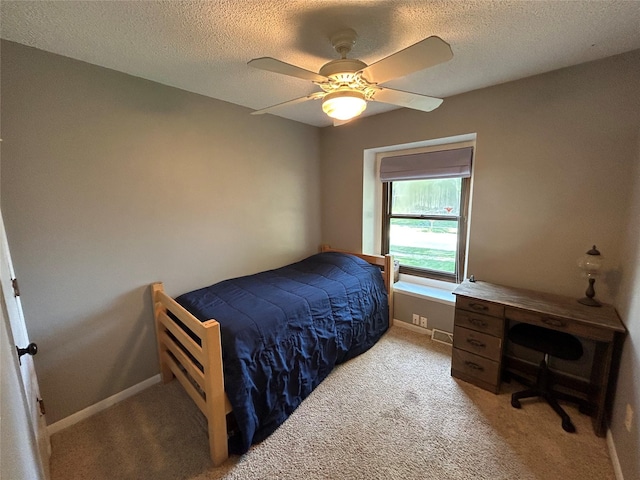 1016 1st St NW, Altoona, IA 50009 - carpeted bedroom featuring a textured ceiling and ceiling fan