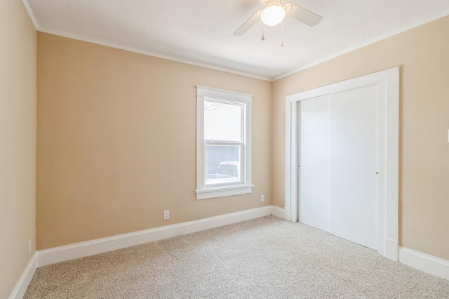 1141 Douglas Ave, Des Moines, IA 50313 - unfurnished bedroom with carpet floors, ornamental molding, a closet, and a ceiling fan
