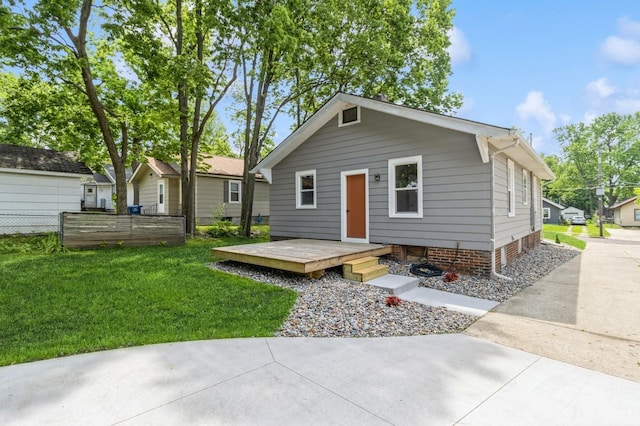 1141 Douglas Ave, Des Moines, IA 50313 - bungalow-style home with driveway and a wooden deck