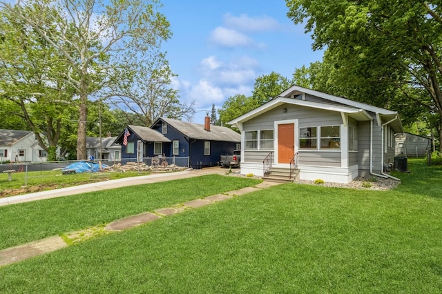 1141 Douglas Ave, Des Moines, IA 50313 - view of front of home with entry steps and a front yard