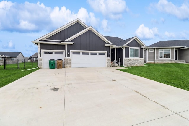 208 11th Ct NW, Bondurant, IA 50035 - craftsman house featuring stone siding, board and batten siding, an attached garage, and driveway