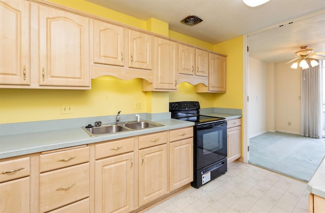 3663 Grand Ave Unit 501, Des Moines, IA 50312 - kitchen featuring light brown cabinetry, black electric range oven, light countertops, and a ceiling fan