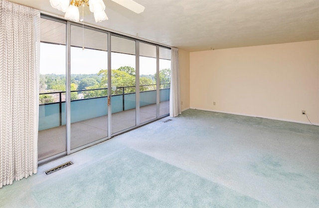3663 Grand Ave Unit 501, Des Moines, IA 50312 - carpeted spare room featuring a ceiling fan and baseboards