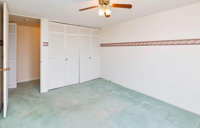 3663 Grand Ave Unit 501, Des Moines, IA 50312 - unfurnished bedroom featuring carpet, a closet, and ceiling fan