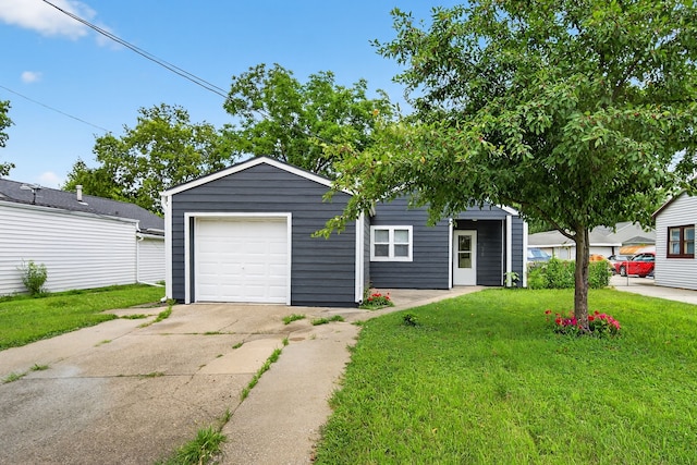 3605 53rd St, Des Moines, IA 50310 - view of front of house featuring driveway, a front yard, and an outbuilding