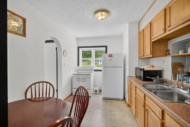 3605 53rd St, Des Moines, IA 50310 - kitchen with a textured wall, white appliances, a textured ceiling, arched walkways, and open shelves