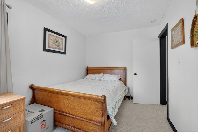 3605 53rd St, Des Moines, IA 50310 - bedroom featuring light colored carpet and a textured ceiling