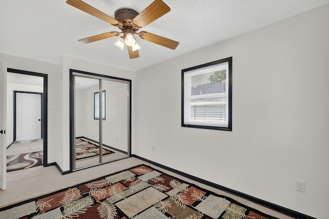 3605 53rd St, Des Moines, IA 50310 - unfurnished bedroom with a closet, a ceiling fan, and light carpet