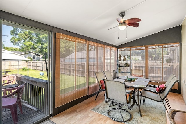 4104 1st St, Des Moines, IA 50313 - sunroom featuring vaulted ceiling, ceiling fan, and outdoor dining space