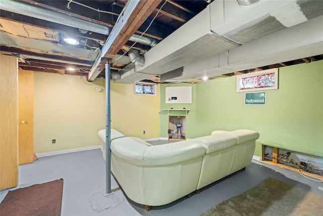 4104 1st St, Des Moines, IA 50313 - living area featuring finished concrete floors and baseboards
