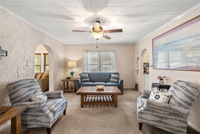 4104 1st St, Des Moines, IA 50313 - living area featuring arched walkways, crown molding, light colored carpet, and ceiling fan