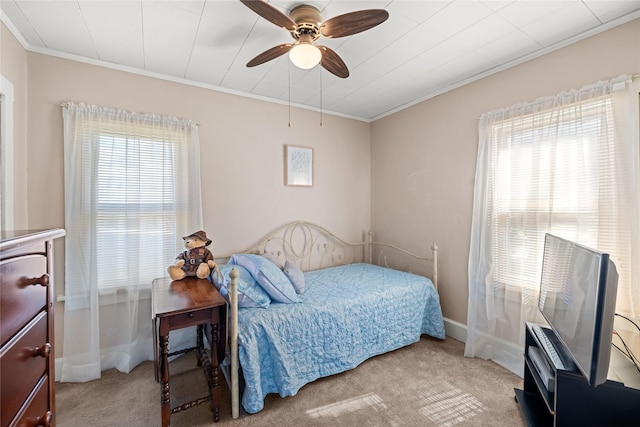 4104 1st St, Des Moines, IA 50313 - carpeted bedroom with ornamental molding and ceiling fan