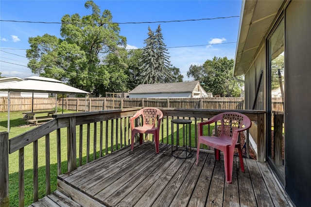 4104 1st St, Des Moines, IA 50313 - wooden terrace featuring a fenced backyard