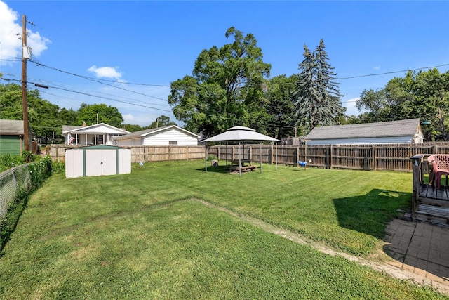 4104 1st St, Des Moines, IA 50313 - fenced backyard with a storage unit and a gazebo