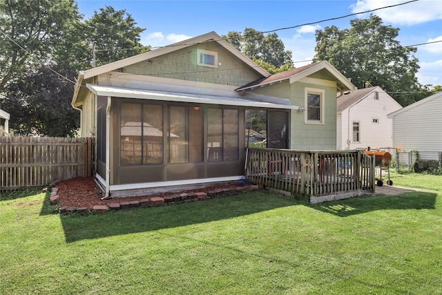 4104 1st St, Des Moines, IA 50313 - rear view of property featuring a sunroom and a deck