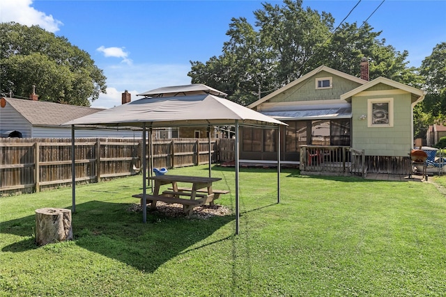 4104 1st St, Des Moines, IA 50313 - view of yard featuring a gazebo and a sunroom
