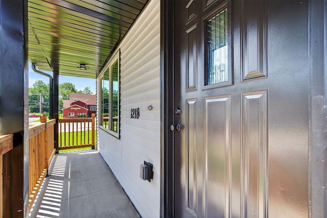 1218 Mccormick St, Des Moines, IA 50316 - view of exterior entry featuring a porch