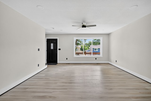 1218 Mccormick St, Des Moines, IA 50316 - unfurnished room featuring light wood-style floors and a ceiling fan