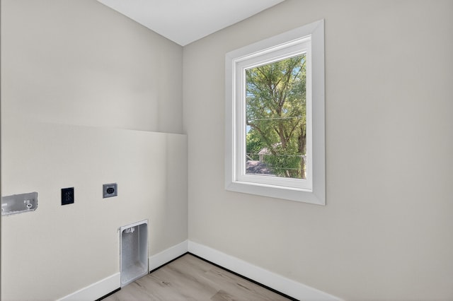1218 Mccormick St, Des Moines, IA 50316 - washroom with hookup for an electric dryer and light wood-style floors