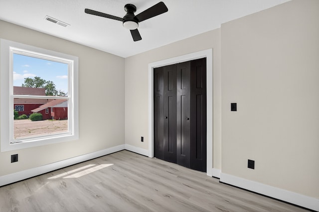 1218 Mccormick St, Des Moines, IA 50316 - unfurnished bedroom featuring light wood-type flooring, a closet, and a ceiling fan