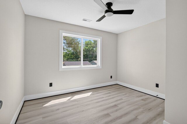 1218 Mccormick St, Des Moines, IA 50316 - empty room with wood finished floors and ceiling fan