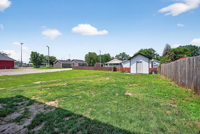 1218 Mccormick St, Des Moines, IA 50316 - view of yard featuring a storage unit