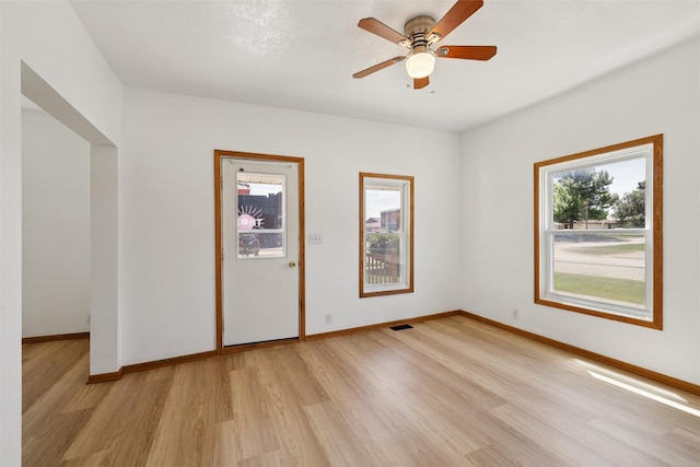 204 N Gaines St, Stuart, IA 50250 - unfurnished room featuring light wood-style flooring and ceiling fan
