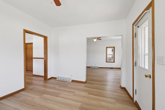204 N Gaines St, Stuart, IA 50250 - unfurnished room featuring a ceiling fan and light wood-style floors