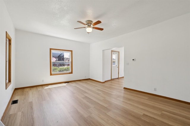 204 N Gaines St, Stuart, IA 50250 - unfurnished room with light wood-style floors and ceiling fan