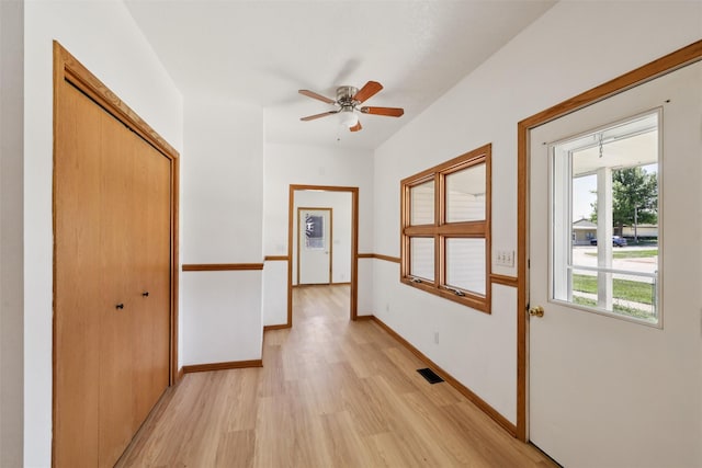 204 N Gaines St, Stuart, IA 50250 - corridor featuring light wood-style flooring and baseboards