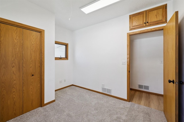 204 N Gaines St, Stuart, IA 50250 - unfurnished bedroom featuring light carpet