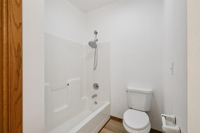204 N Gaines St, Stuart, IA 50250 - bathroom featuring wood finished floors and shower / bathtub combination