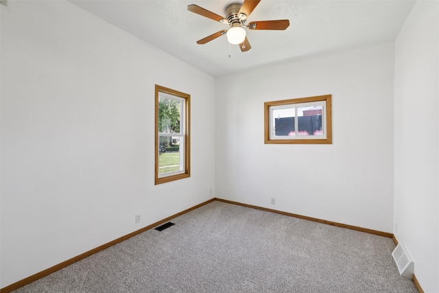 204 N Gaines St, Stuart, IA 50250 - empty room featuring carpet floors and ceiling fan